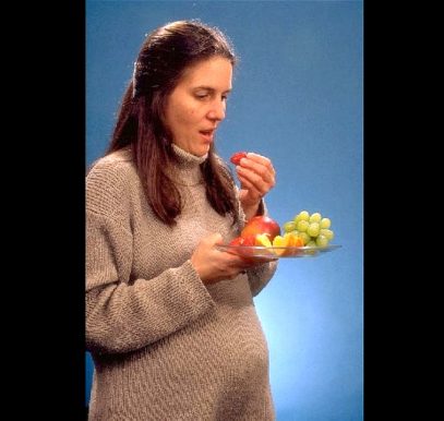 ImaNutrition in pregnancy pregnant woman eating strawberries grapesge from pixnio.com