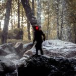 person standing on rock during daytime