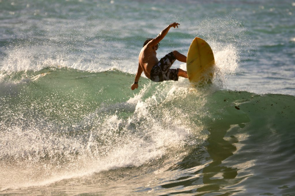 a man surfing on a wave