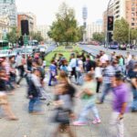 timelapse photo of people passing the street